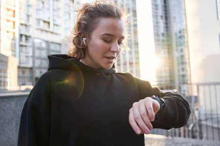 Woman checking pulse on her watchの写真素材