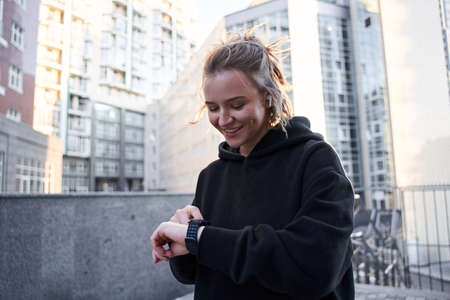 Woman looking at watch clockの写真素材