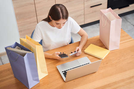 Woman enter credit card detailsの写真素材