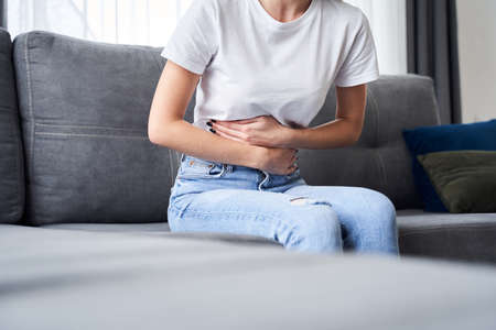 Woman holding her bellyの写真素材