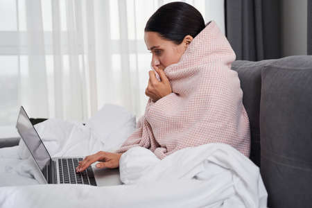 Woman wrapped in body blanketの写真素材