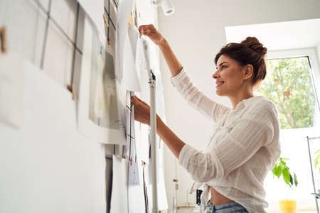 Woman looking at her finished sketchesの写真素材