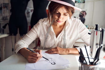 Woman drawing sketch of new designの写真素材