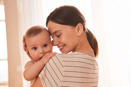 Mother enjoying pastime with her lovely baby