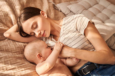 Mother breastfeeding her childの写真素材