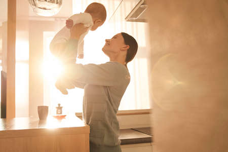 Mom enjoying time with her newbornの写真素材
