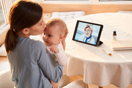 Mother holding her little newbornの写真素材