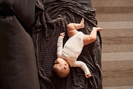 Child laying at the blanketの写真素材