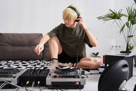 Sound engineer adjusting her headphone setの写真素材