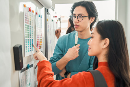 Portrait of future UI designers discussing new interface design for smartphoneの写真素材