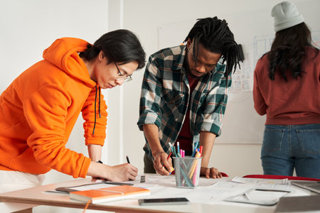Young multiracial future designers putting on the table iconsの写真素材