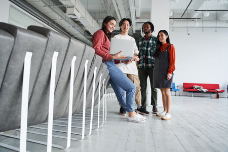 Group of students or teenagers with laptop computerの写真素材