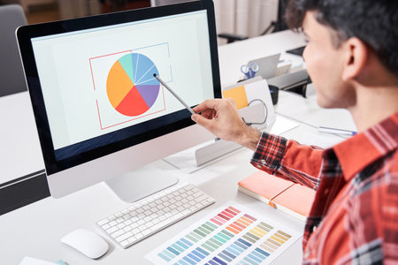 Designer looking at colour chartの写真素材