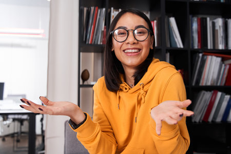 Designer is smiling toothy while developing a web applicationの写真素材