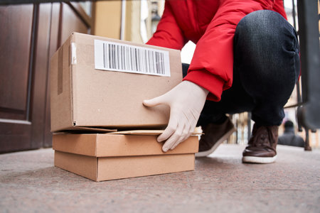 Courier has come at house and putting box near entranceの写真素材