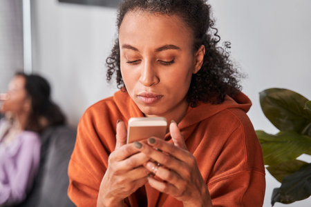 Woman dictates a voice message on cellphone