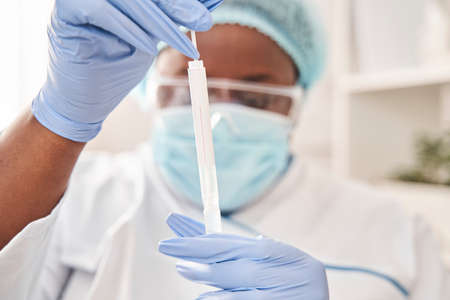 Respiratory sputum specimen swab test tube with gloves