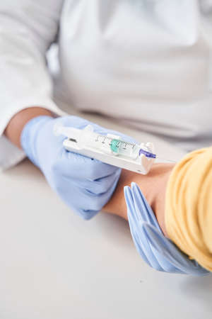 Nurse doing anti covid syringe to caucasian woman