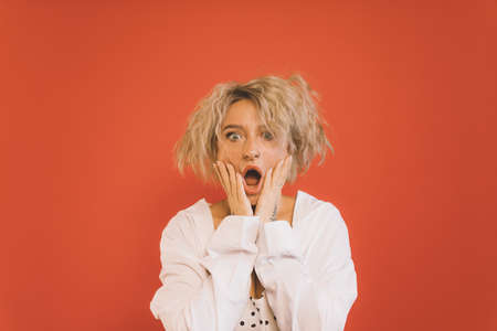 Woman having shock facial emotion and open mouth