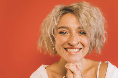 Woman looking at the camera while posing at studioの写真素材