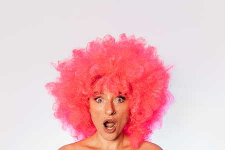 Woman having shock facial emotion and open mouthの写真素材