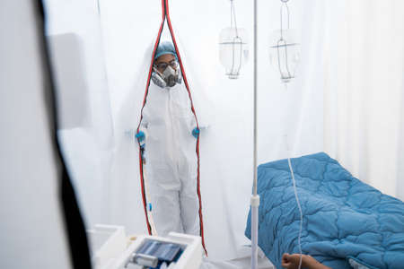 Female doctor at work inside hospital during coronavirus outbreak