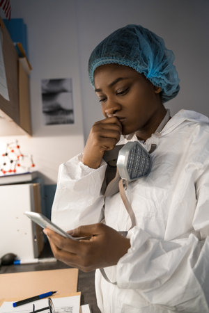 Nurse reading negative statistic about coronavirus disease at the worldの写真素材