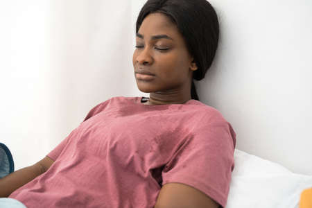 Multiracial ill patient spending time at the isolation unit in hospitalの写真素材