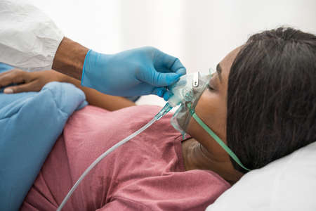 Medical worker is trying to encourage and treat symptoms better of patientの写真素材