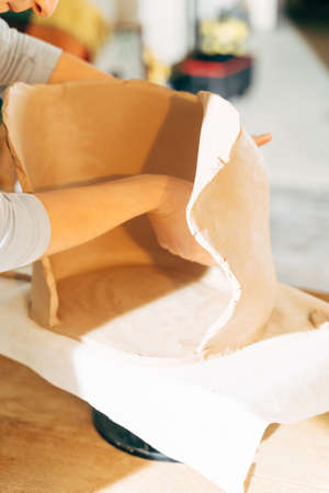 Unrecognized girl learning handicraft in potteryの写真素材