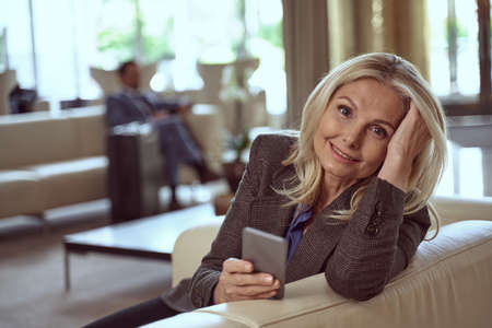 Pretty lady having trouble checking in the hotel onlineの写真素材