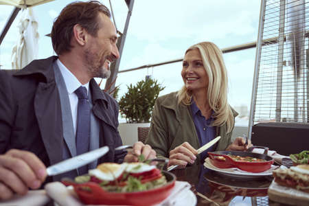 Two hotel tenants enjoying morning over a tasty breakfastの写真素材