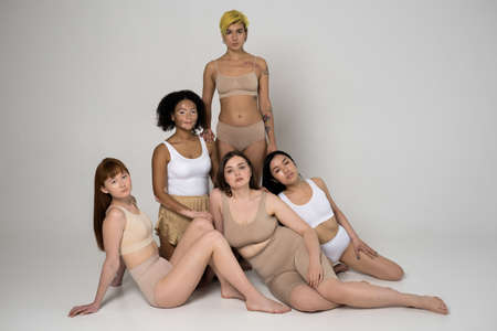 Women with different race and body sizes posing in underwearの写真素材