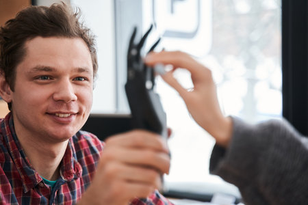 Engineer showing a new artificial limb for his client or patientの写真素材