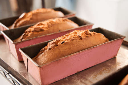 Bakeware with cakes standing at the trolley and preparing for the salling