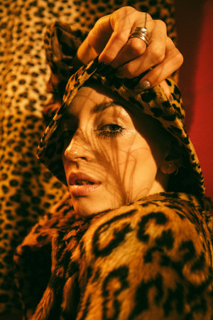 Woman with freckles skin posing with open mouth in front of the cameraの写真素材