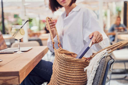 Close up of girl opening her bagの写真素材