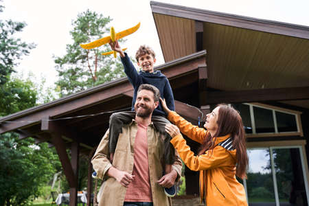 Happy family having fun together outside the house