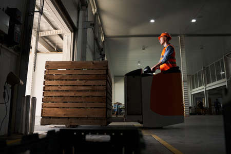 Forklift operator in warehouseの写真素材