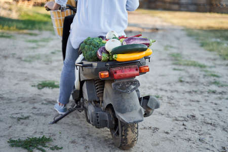 Close up shot of girl sitting on scooterの写真素材