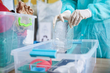 Woman sorting plastic bottlesの写真素材