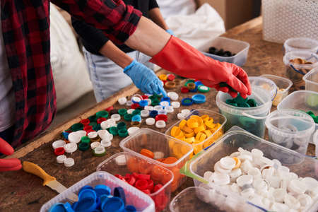 People sorting materials in the waste sorting plant