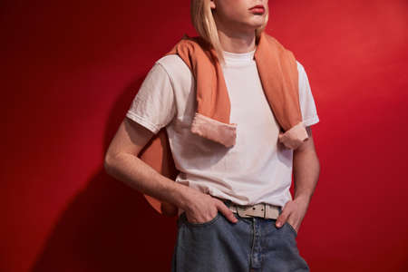 Feminine model man wearing casual clothes posing with serious faceの写真素材