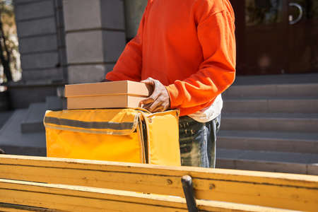 Delivery man preparing to giving package to customer
