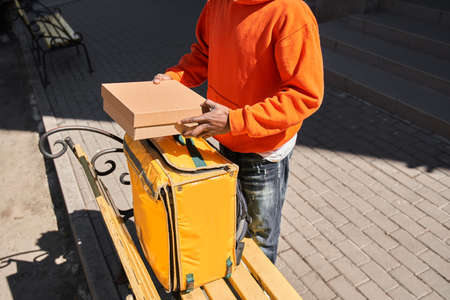 Multiracial man holding parcel cardboard box