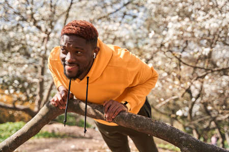 Sportsman dressed in running outfit doing push ups before physical workoutの写真素材