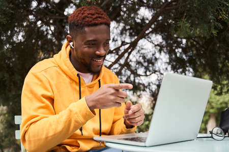 Business man wearing casual clothes working on laptop in restaurantの写真素材