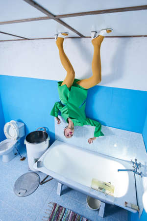 Strong woman wearing bright clothes posing at the creative studio while standingの写真素材