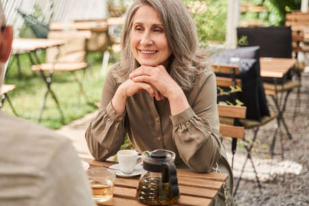 Woman looking with tenderness at her husband while enjoying of they romantic date