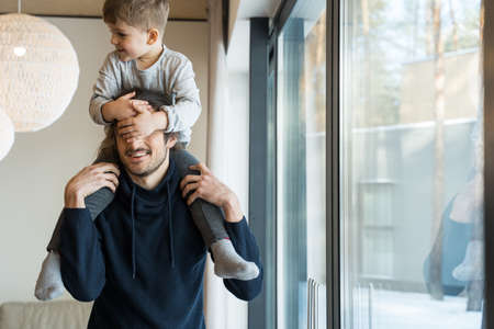 Father holding his son at the shouldersの写真素材